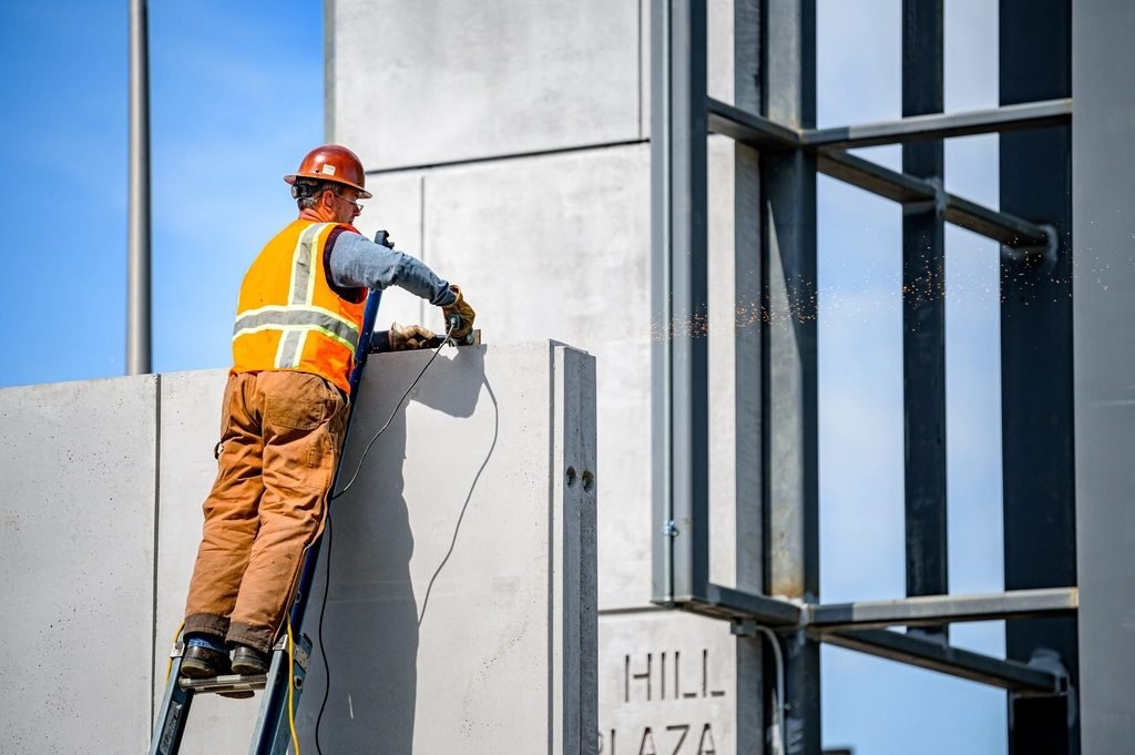 Exterior painting and stucco finishing on a building